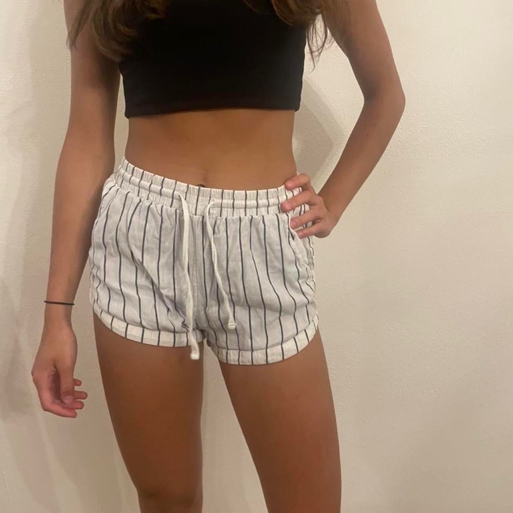 White and navy billabong beach shorts.